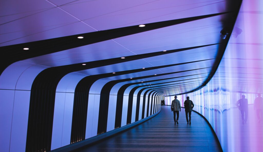 business leaders envisioning future in futuristic architectural tunnel