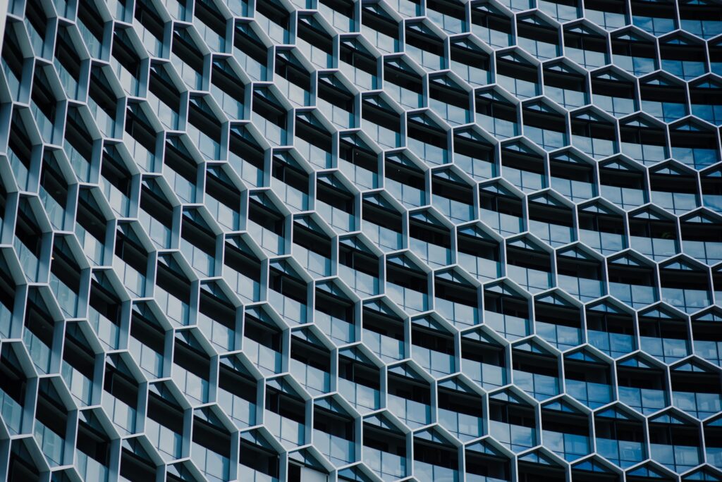 modern building facade with hexagonal structure design reflecting architectural order